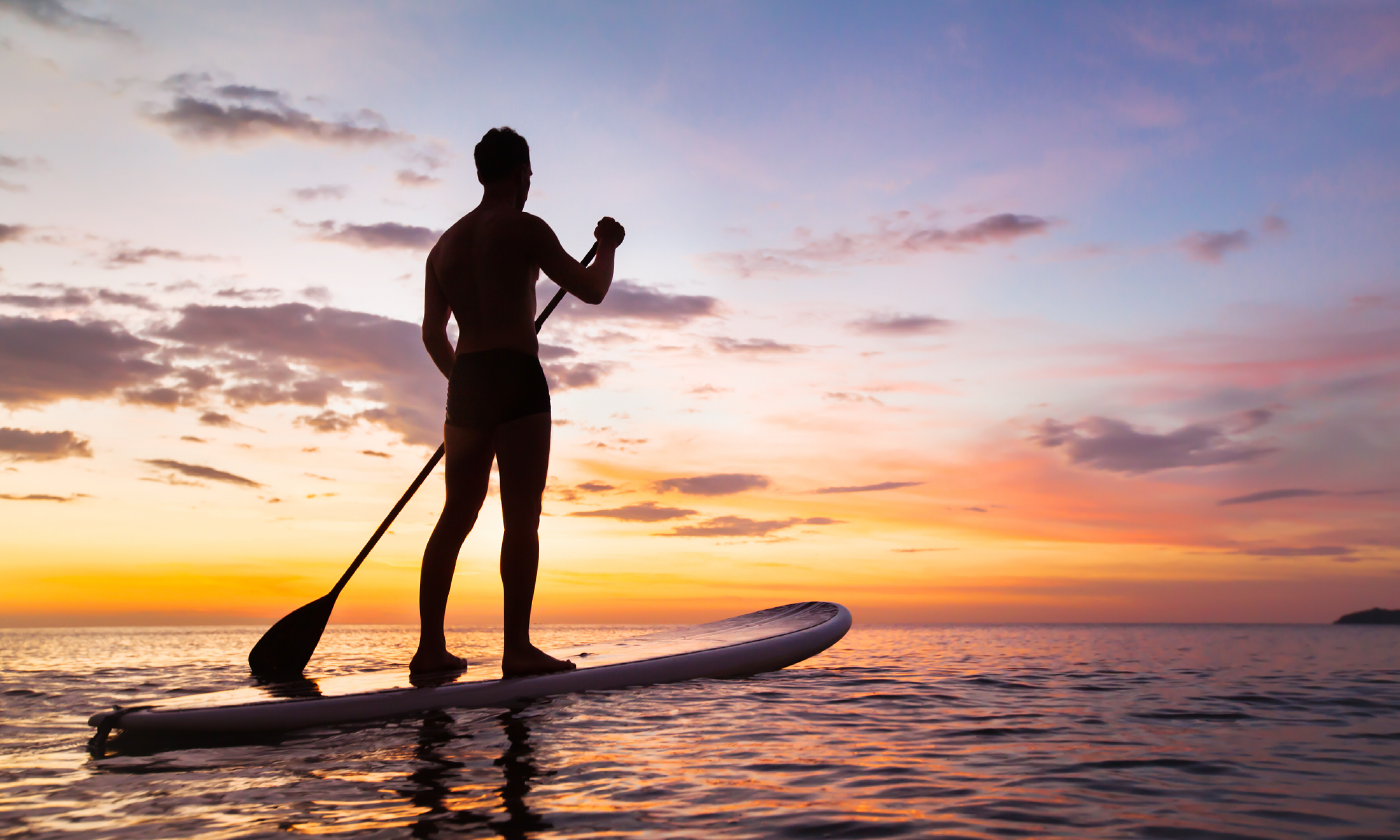 Paddleboarding at sunset